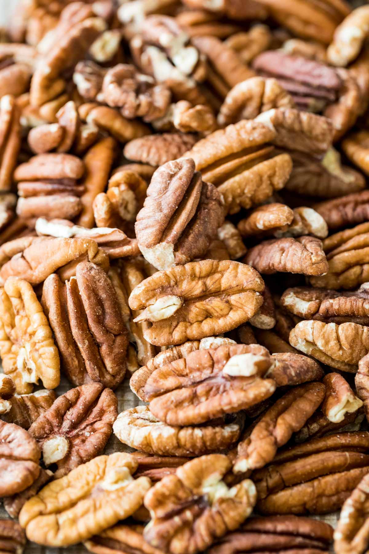 close-up photo of whole toasted pecans