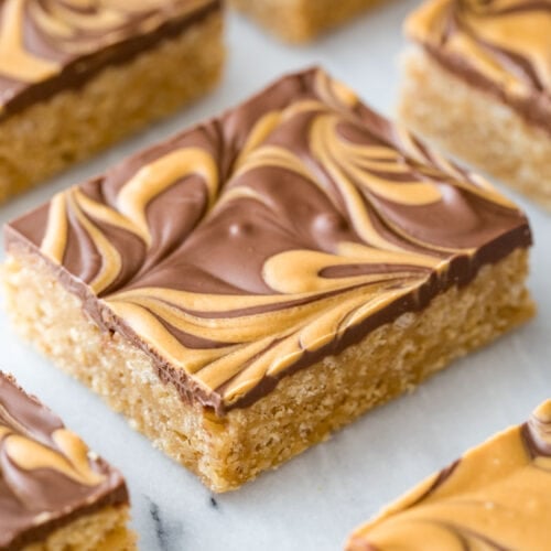 neatly cut scotcharoos with a swirled chocolate and butterscotch topping