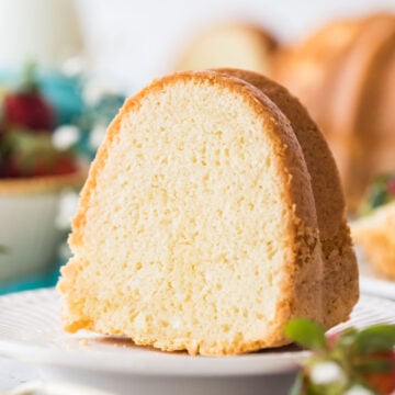 slice of sour cream pound cake on a white plate