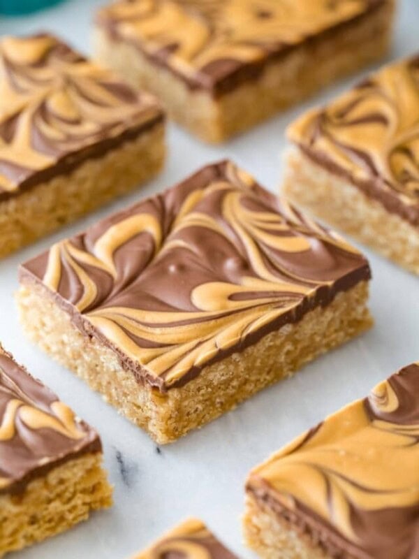 neatly cut scotcharoos with a swirled chocolate and butterscotch topping