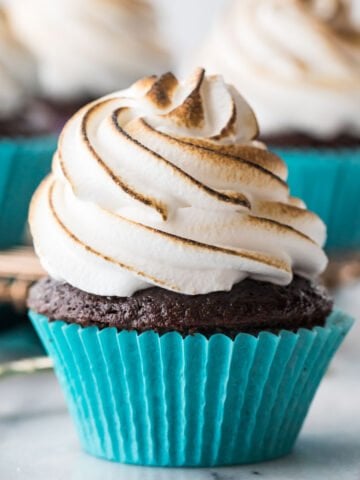 chocolate cupcake frosted with marshmallow icing that's been toasted with a culinary torch
