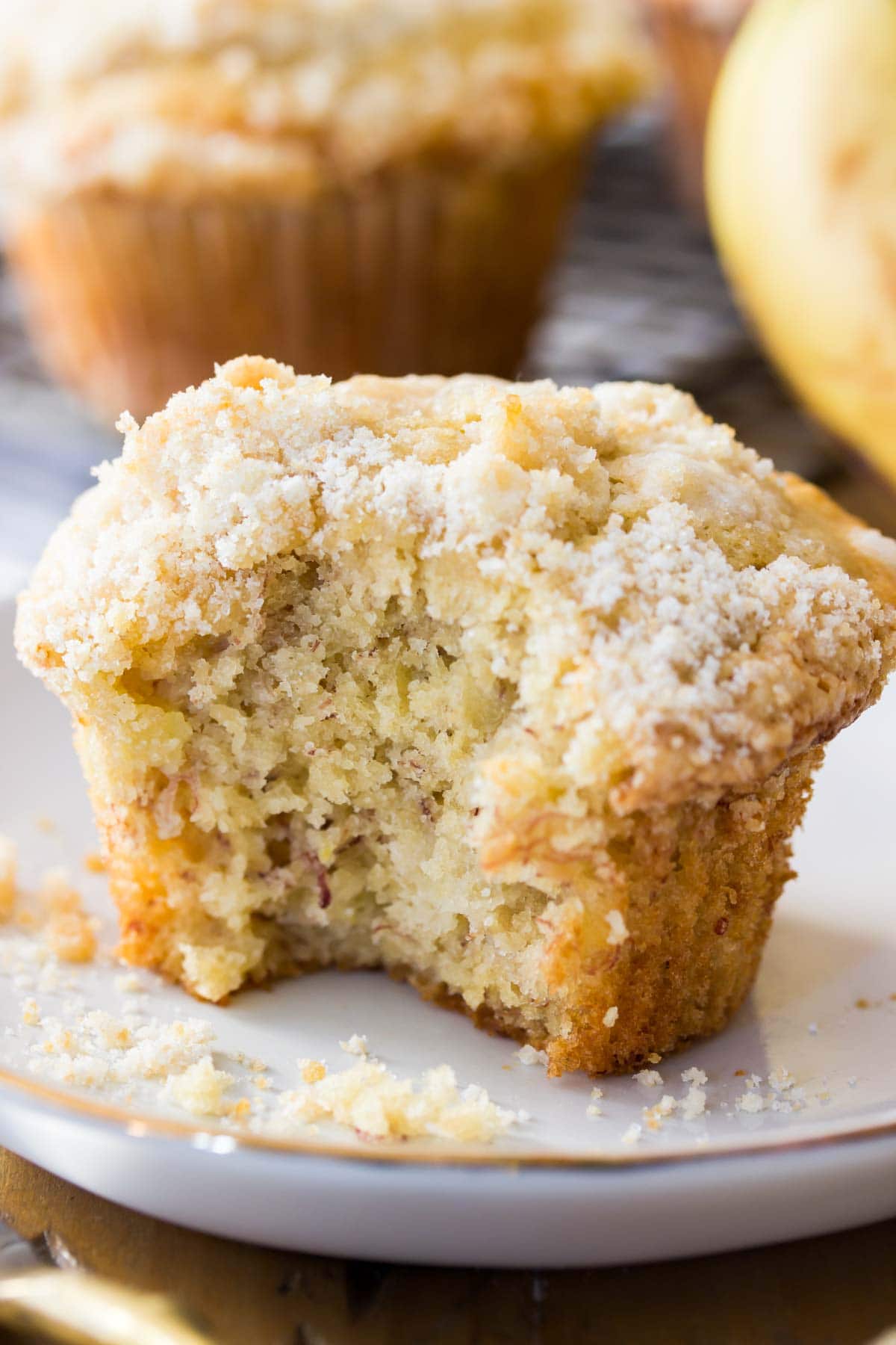 streusel topped banana muffin missing a bite