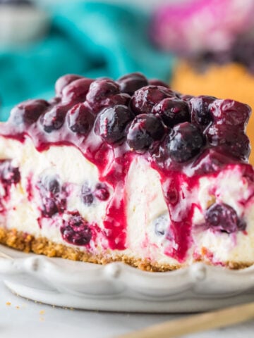 slice of blueberry cheesecake topped with blueberry topping