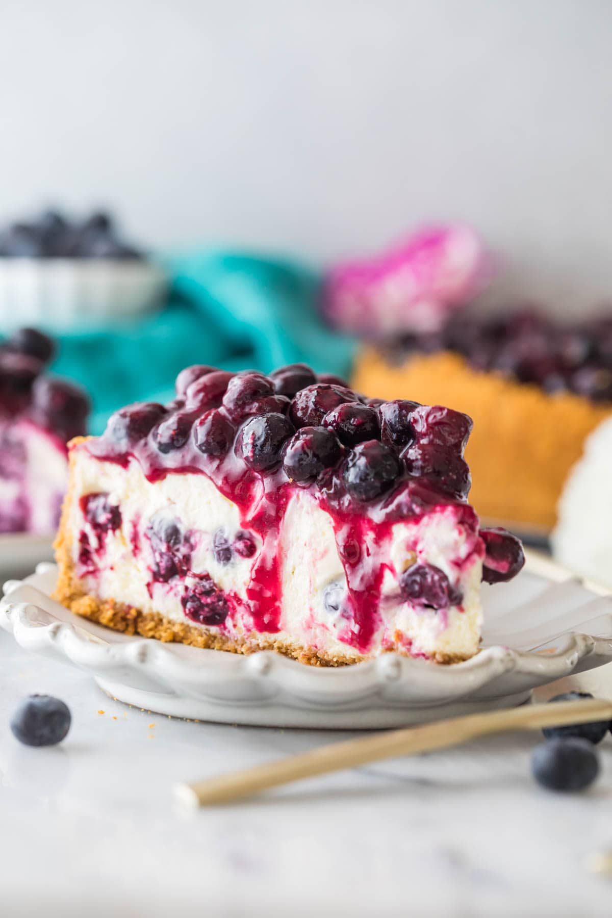 slice of blueberry cheesecake topped with blueberry topping