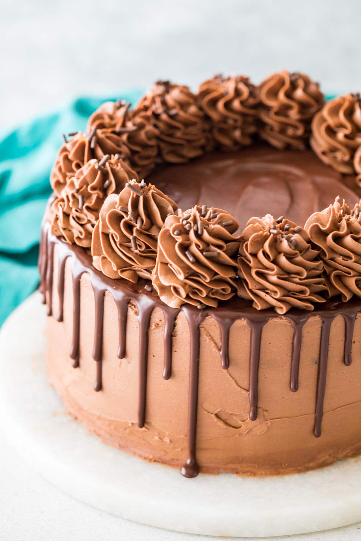 cake decorated with chocolate frosting and a ganache drip