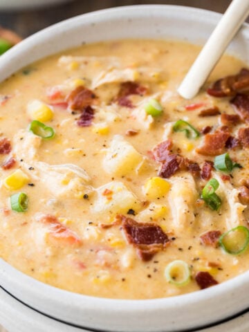 bowl of chicken corn chowder topped with bacon and green onions