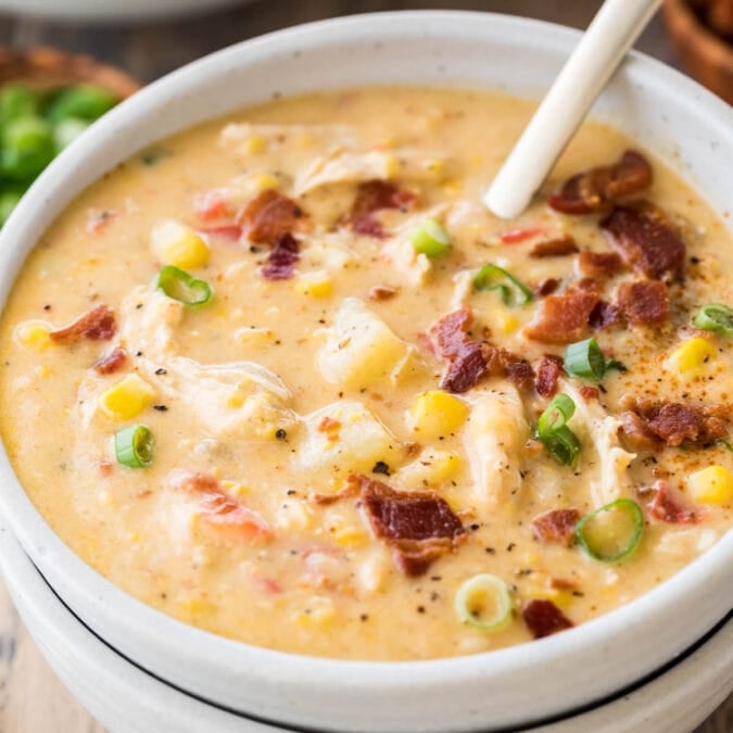 bowl of chicken corn chowder topped with bacon and green onions