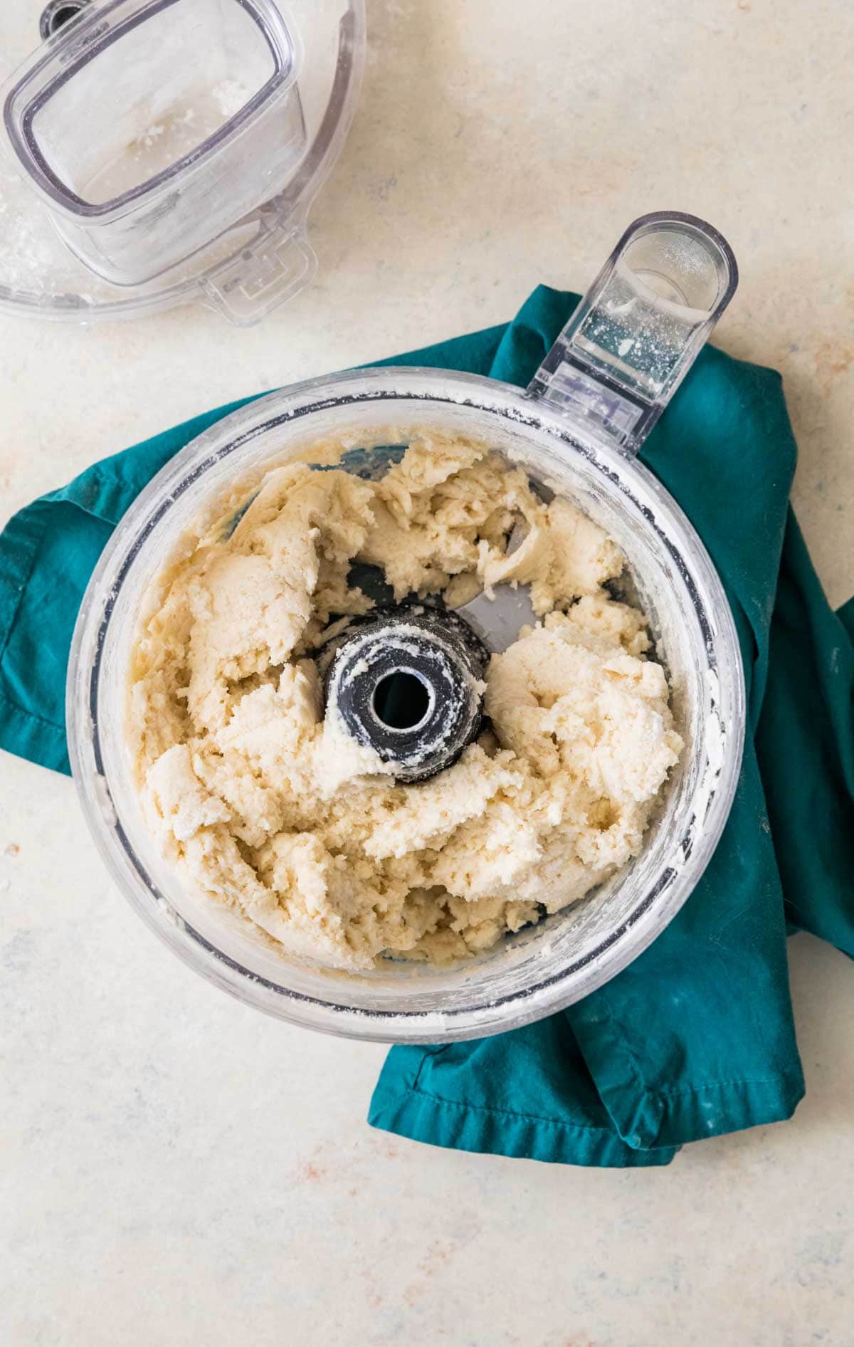 overhead view of cobbler topping being combined in a food processor