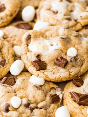 close-up view of smores cookies topped with chocolate and marshmallows