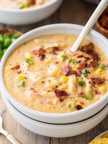 bowl of chicken corn chowder topped with bacon and green onions