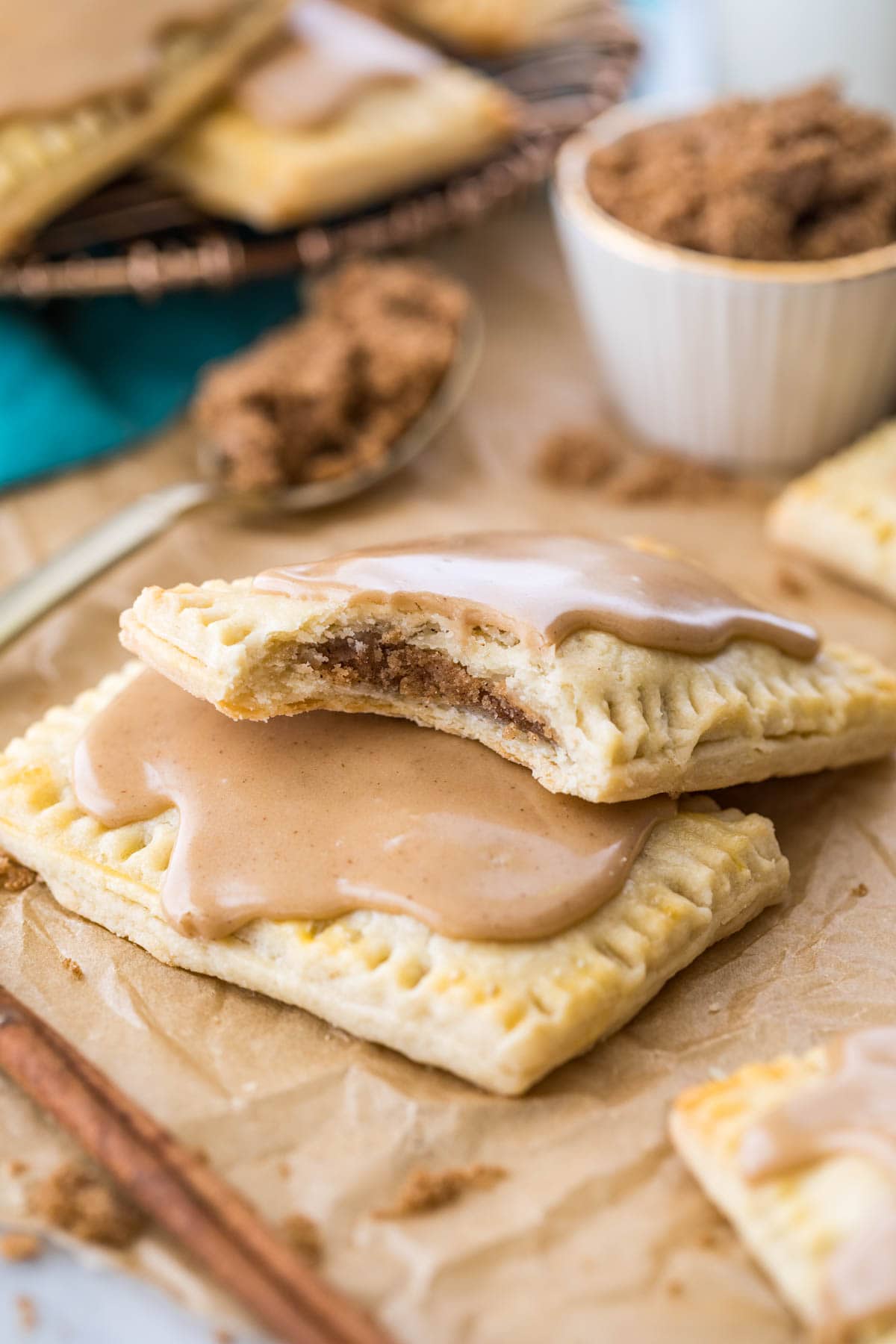 two homemade pop tarts stacked on top of each other, with the top pop tart missing a bite