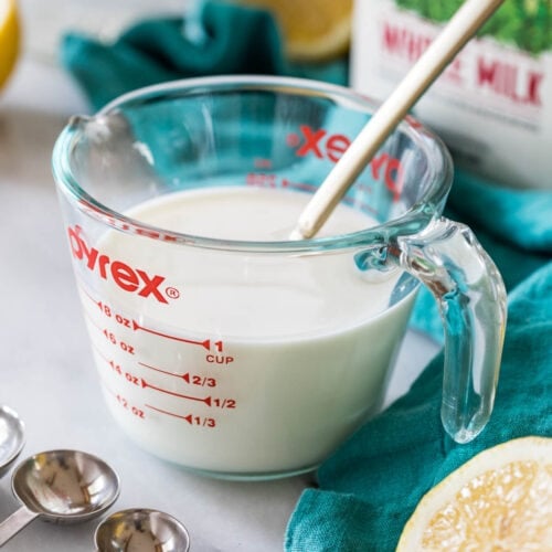 liquid measuring cup full of an easy buttermilk substitute