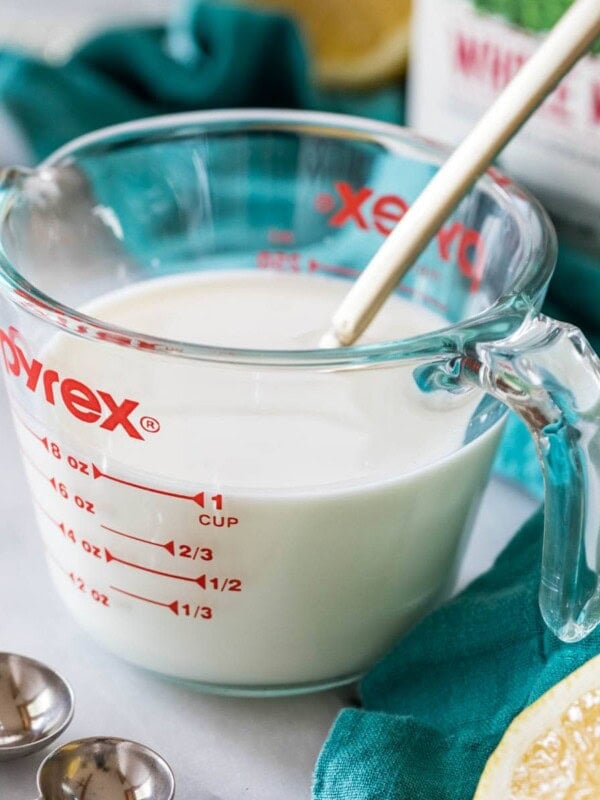 liquid measuring cup full of an easy buttermilk substitute