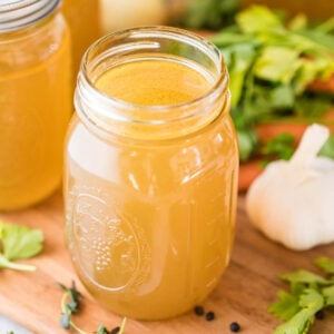 mason jar of chicken broth made from a homemade chicken stock recipe