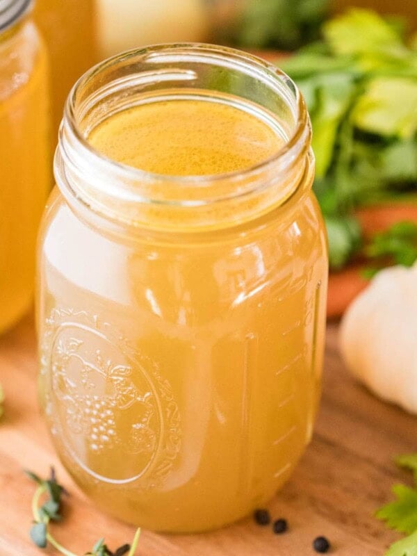 mason jar of chicken broth made from a homemade chicken stock recipe
