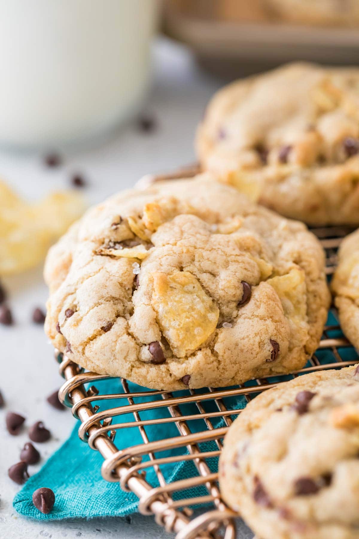 close-up view of a chocolate chip cookie baked with crushed potato chips on a cooling rack