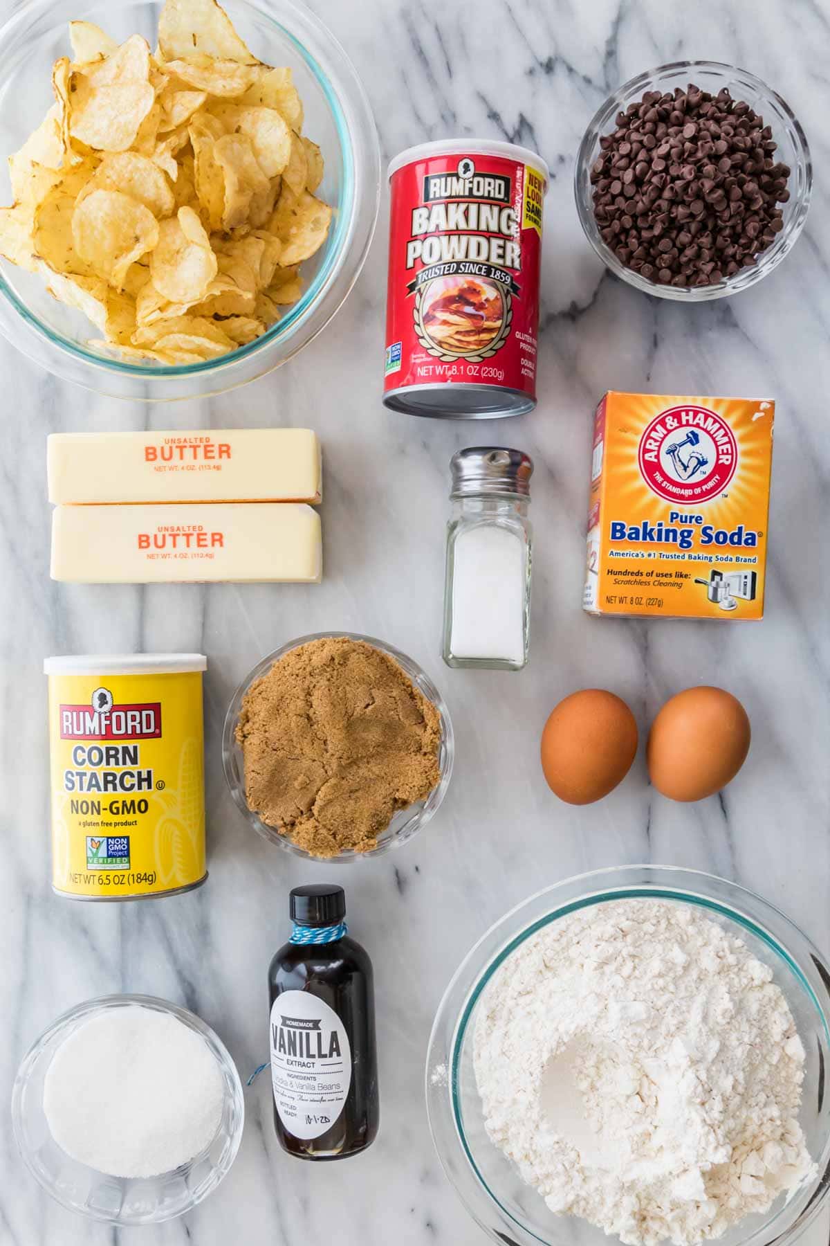 overhead view of ingredients including potato chips, butter, brown sugar, chocolate chips, and more