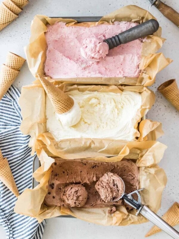 overhead view of three flavors of no churn ice cream including strawberry, vanilla, and chocolate
