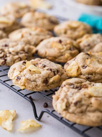 chocolate chip cookies baked with crushed potato chips on a cooling rack