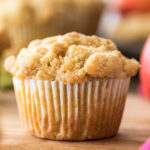 close-up shot of an apple muffin topped with streusel