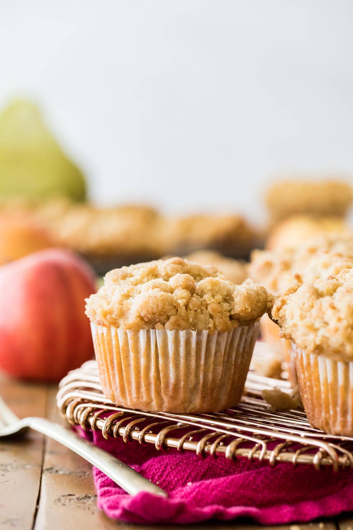 crumb-topped muffins on a cooling rack