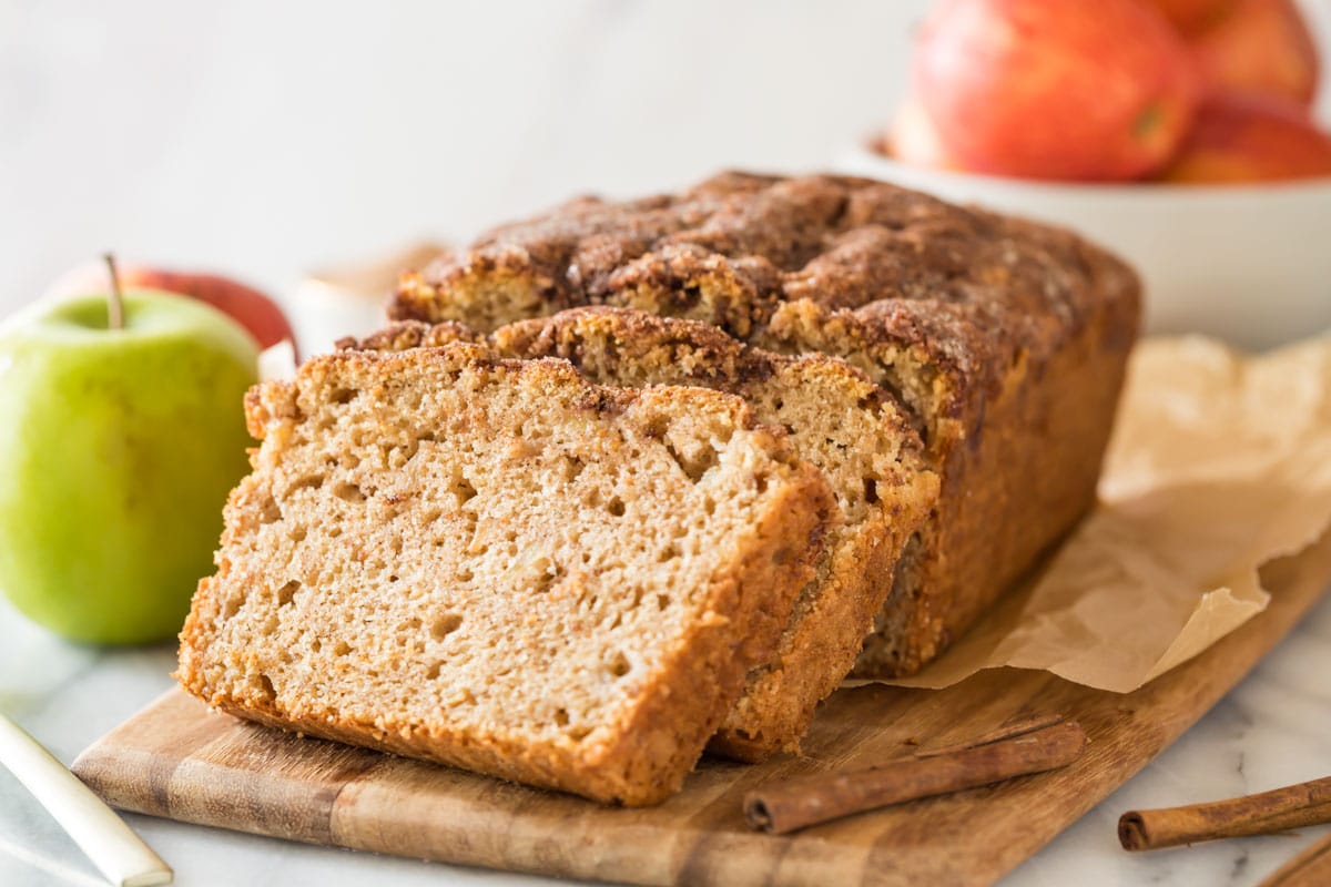 stacked slices of apple bread resting against the remaining loaf