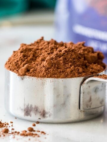 close-up view of a measuring up filled with cocoa powder