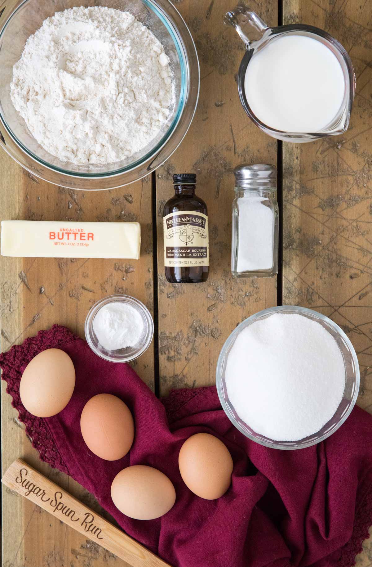 overhead view of ingredients including eggs, flour, butter, sugar, and more