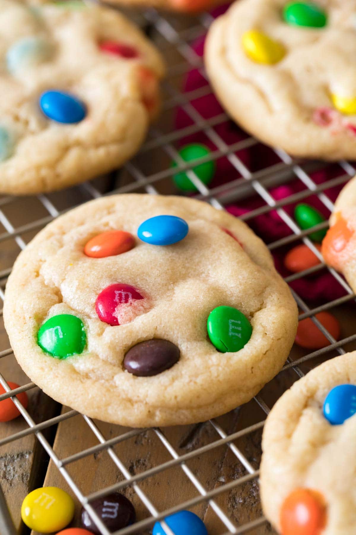 m&m cookies on a cooling rack after baking