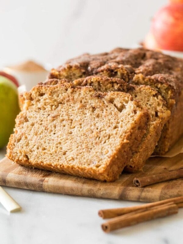 stacked slices of apple bread resting against the remaining loaf