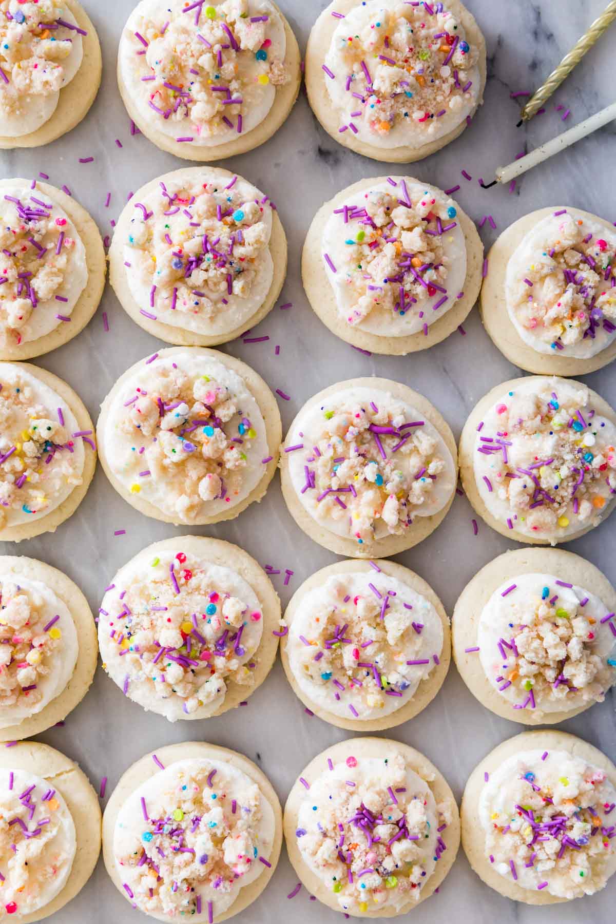 overhead view of frosted birthday cake cookies in neat rows