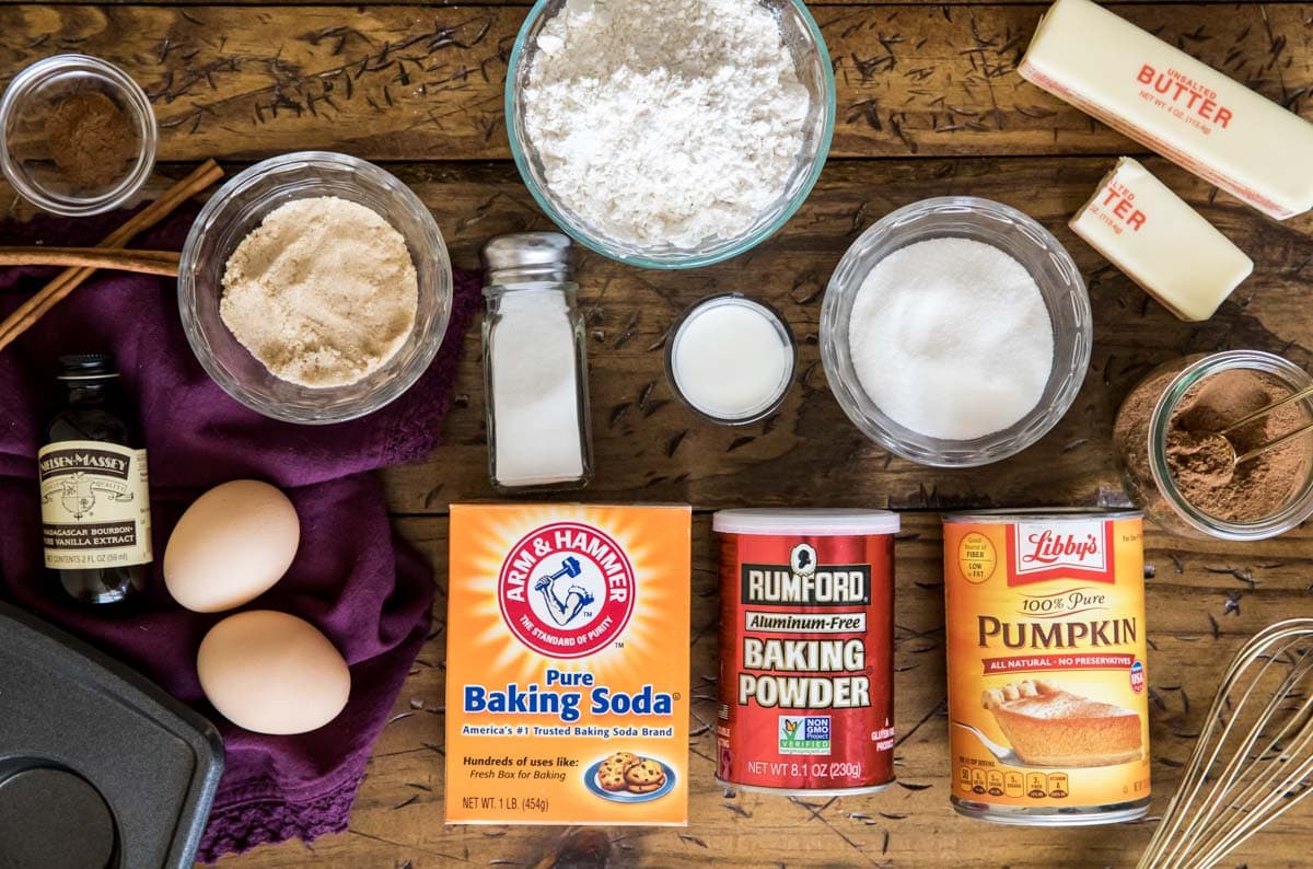 overhead view of ingredients including brown sugar, eggs, pumpkin, and more