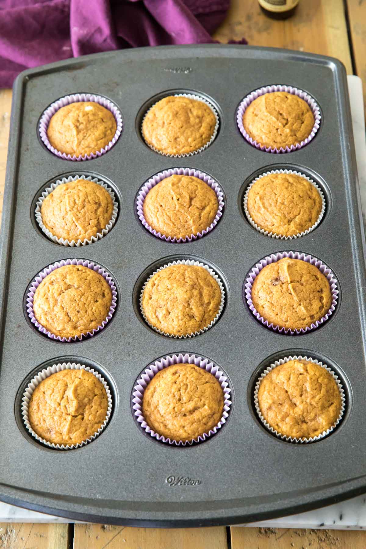 cupcakes in a muffin tin after baking