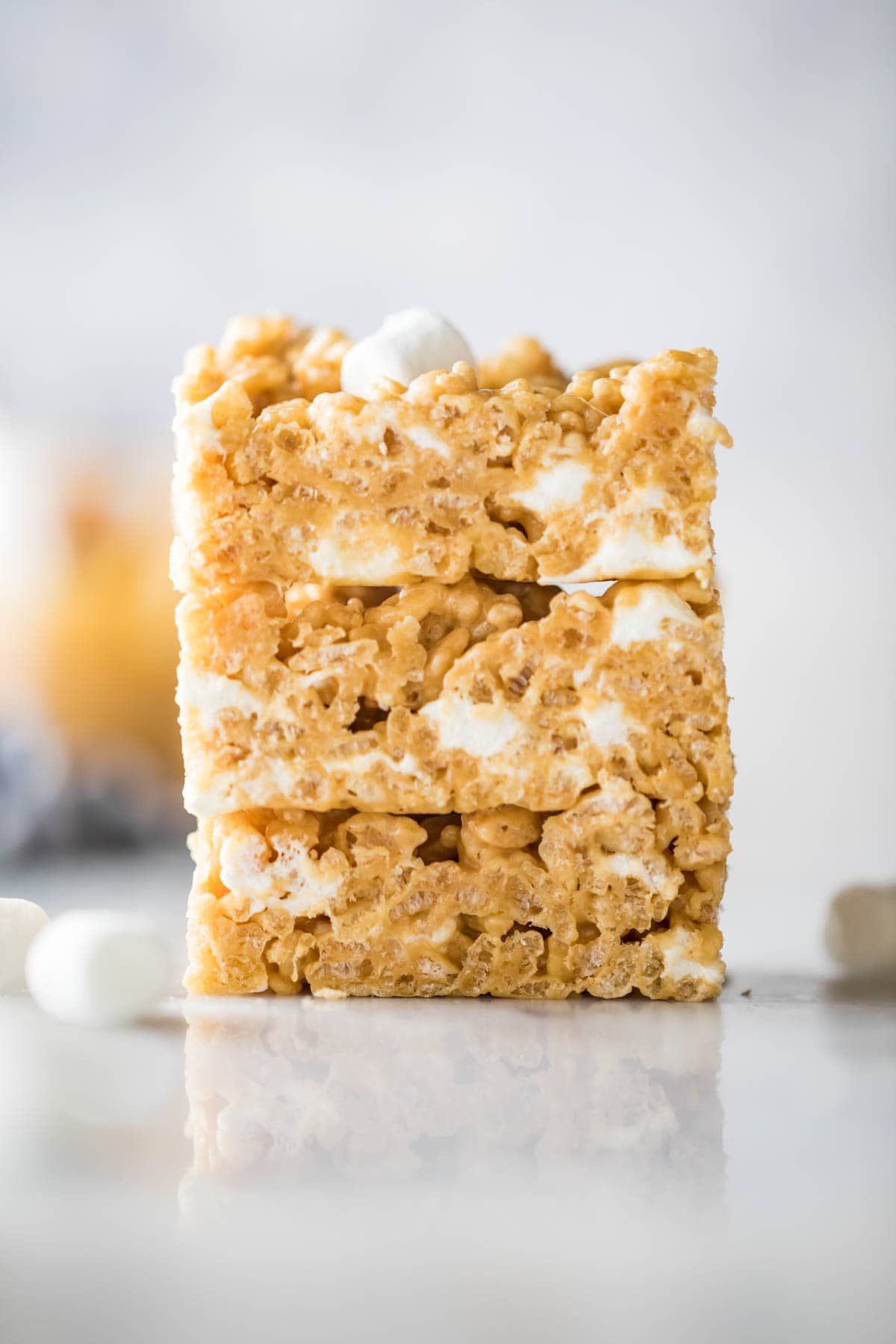 Three peanut butter rice krispie treats stacked on top of each other.
