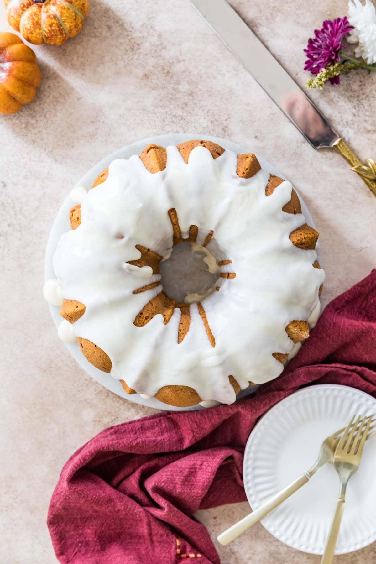 Overhead view of a bundt cake drizzled with white glaze.