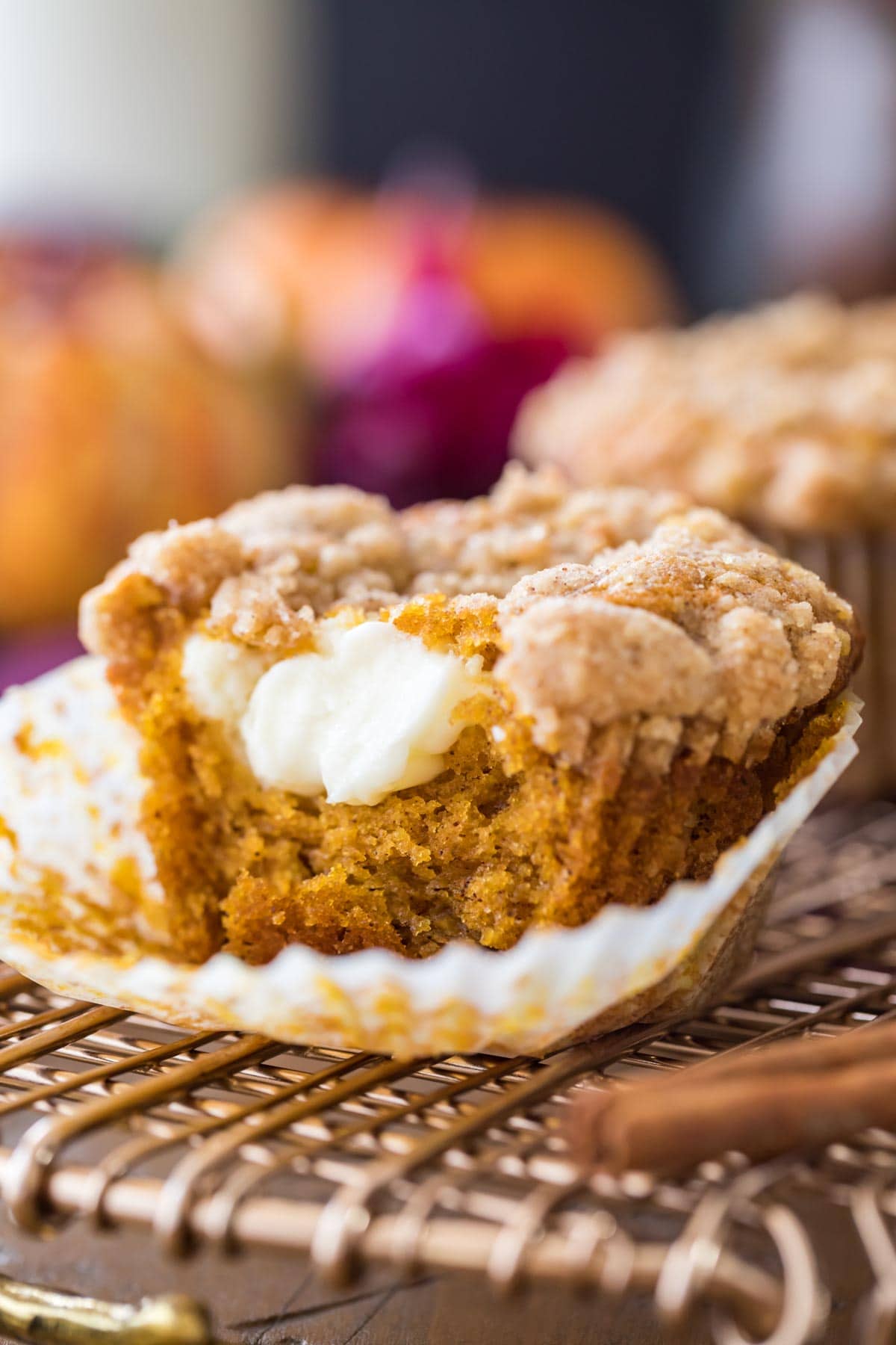 streusel topped muffin stuffed with cream cheese filling