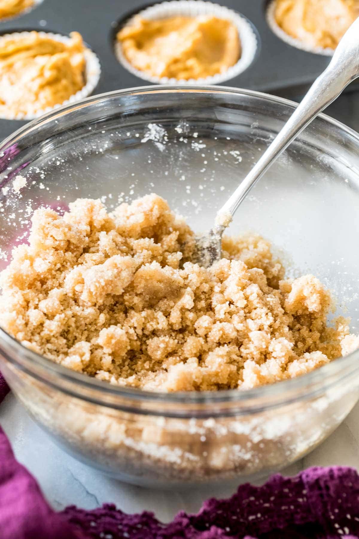 bowl full of homemade streusel to be added to muffins