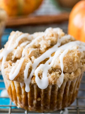 pumpkin muffin topped with streusel and vanilla glaze