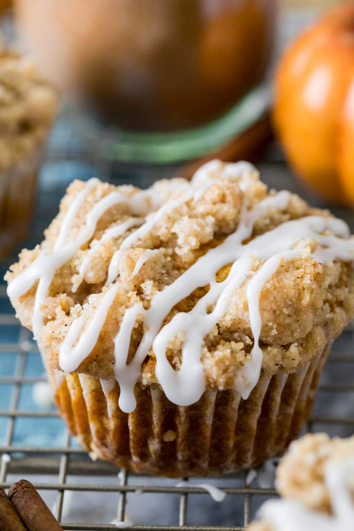 pumpkin muffin topped with streusel and vanilla glaze