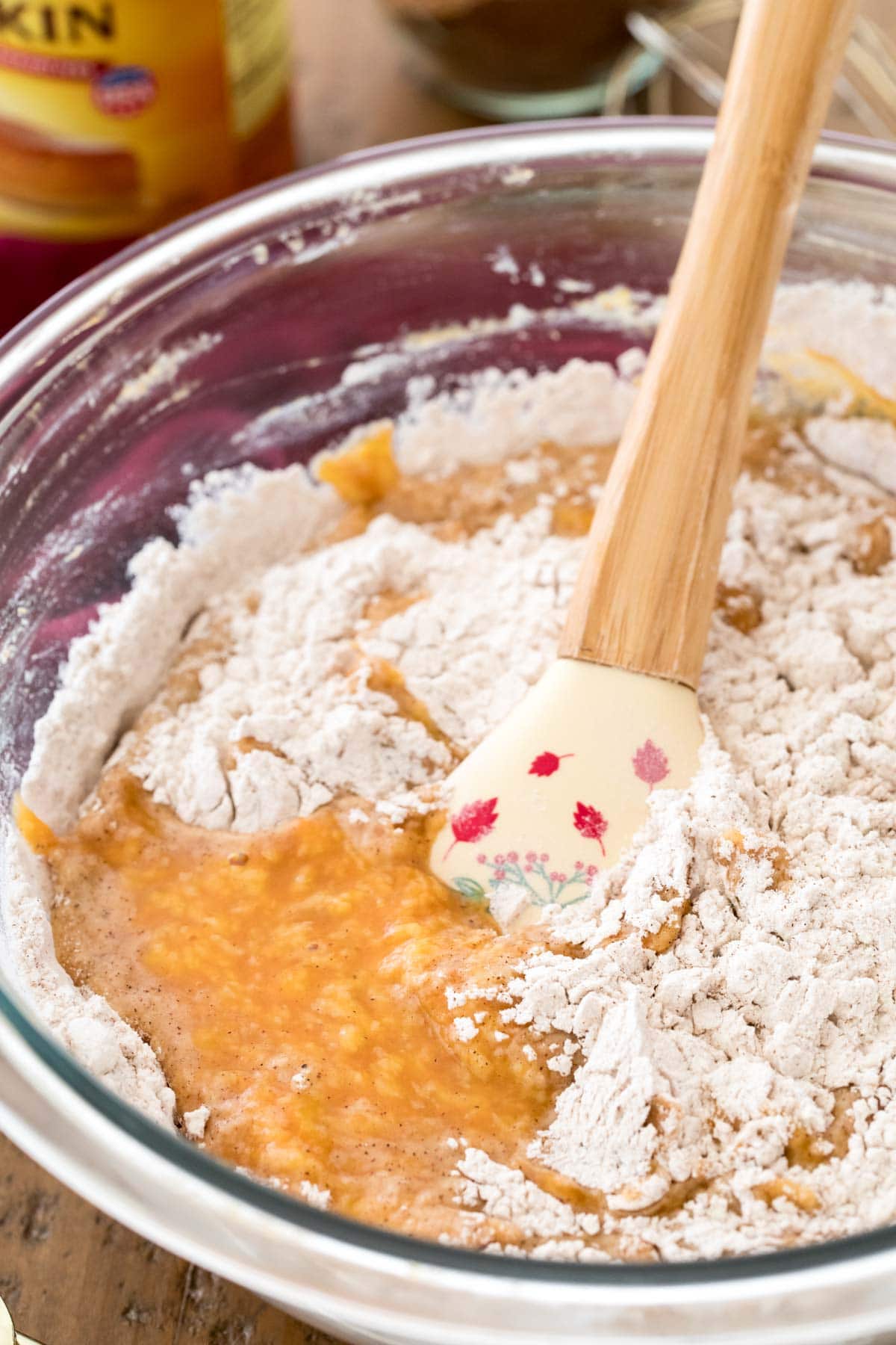 spatula stirring dry ingredients into wet ingredients