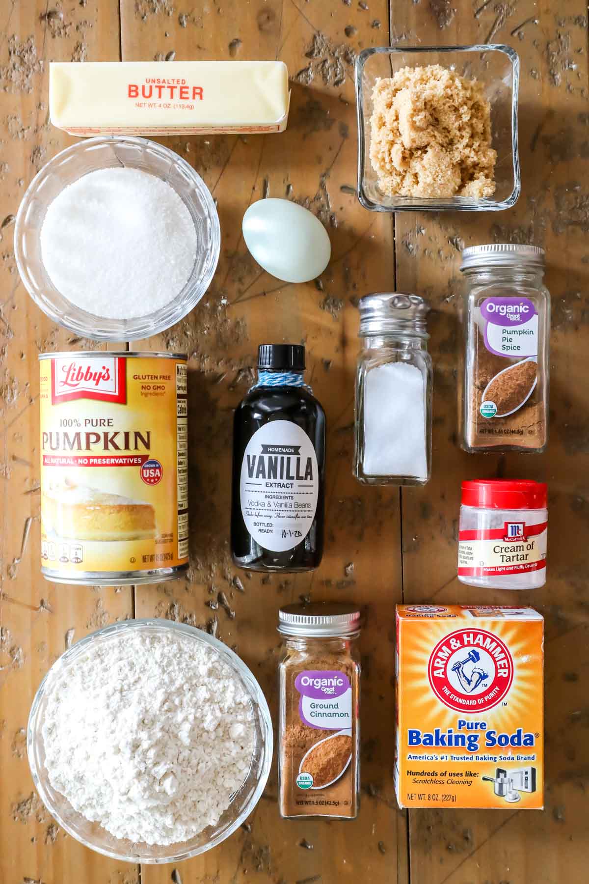 Overhead view of ingredients including pumpkin, cinnamon, flour, cream of tartar, and more.