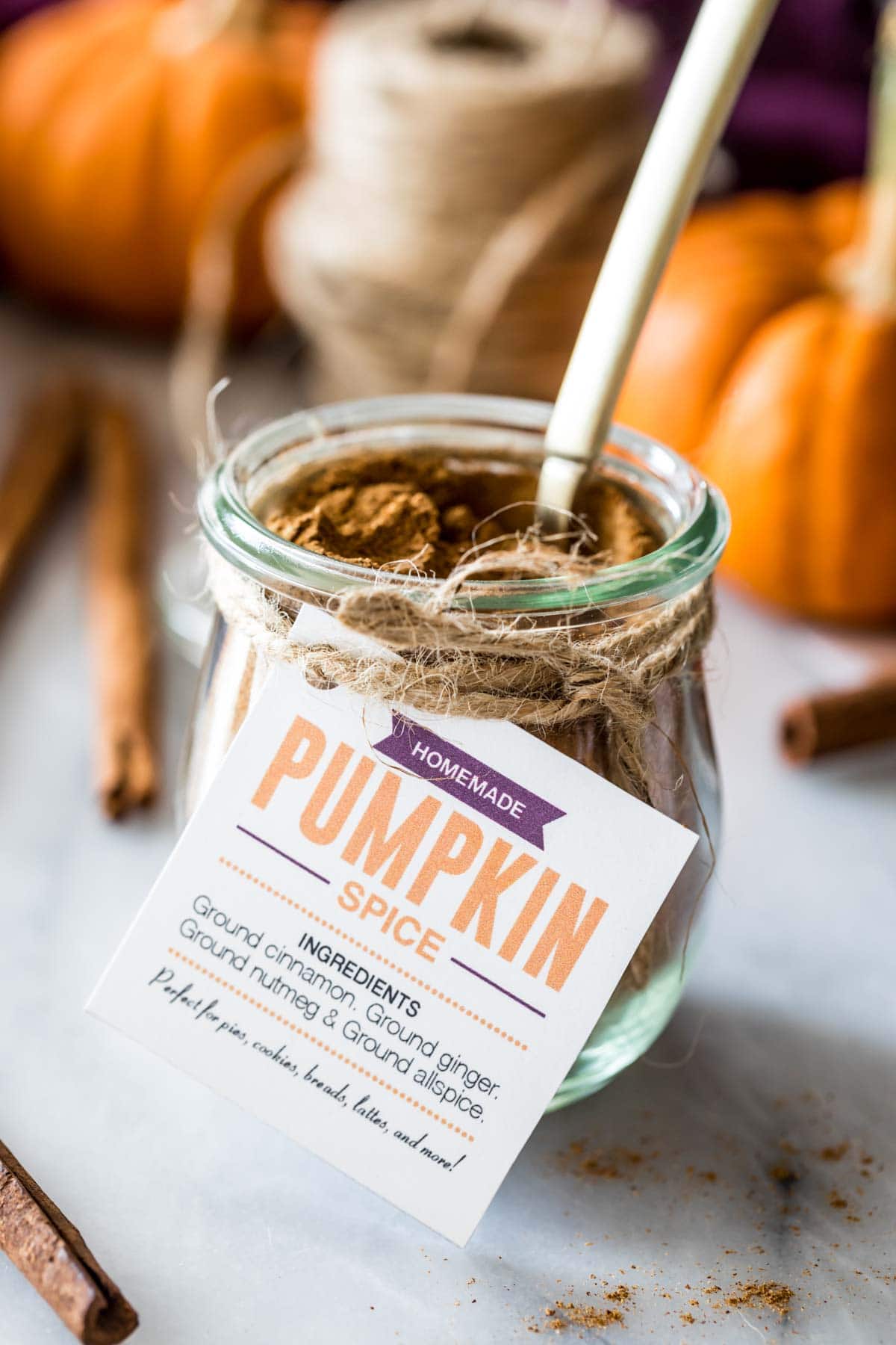 glass jar full of pumpkin spice with a label tag tied to the front