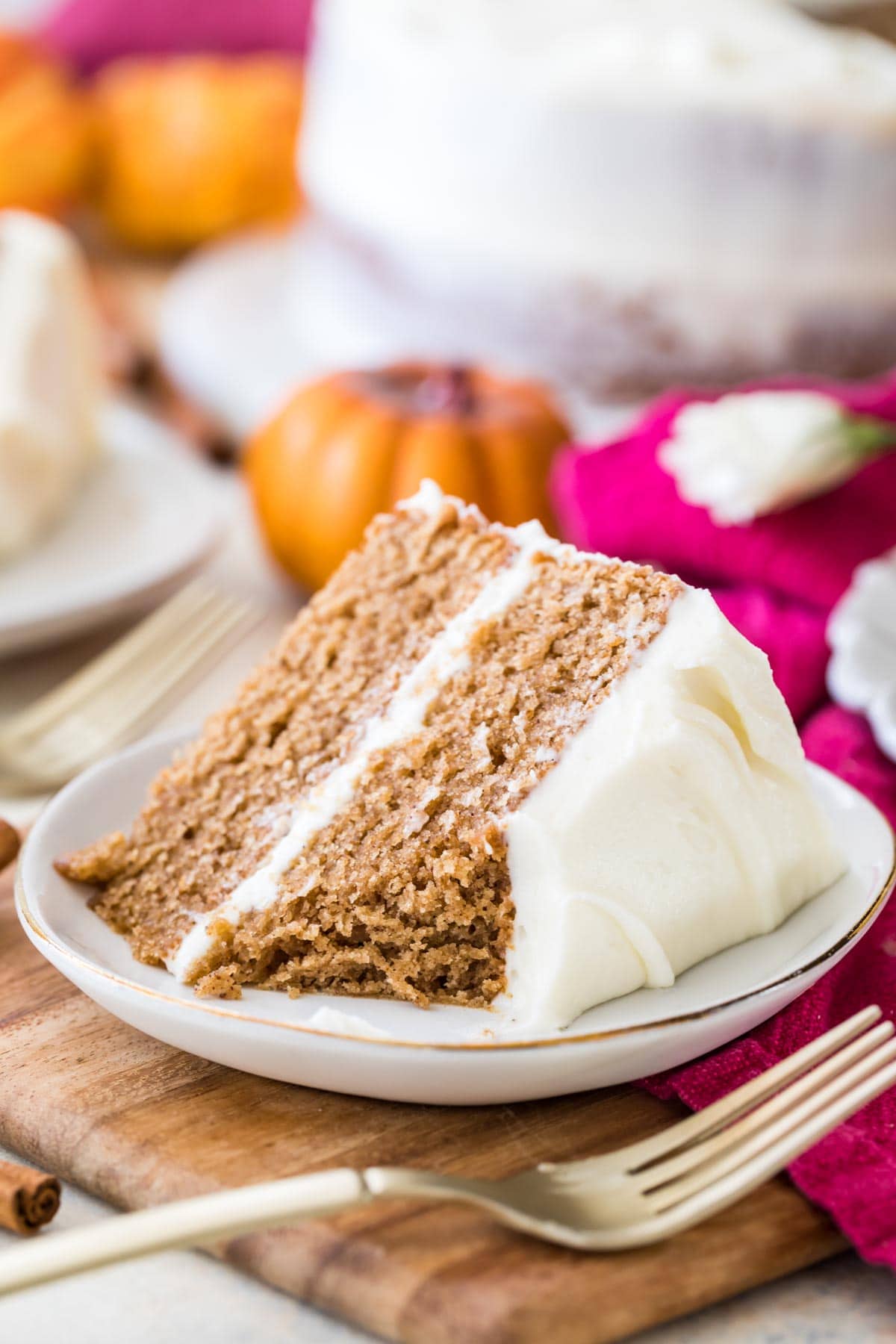 Two-layer slice of spice cake missing one bite.