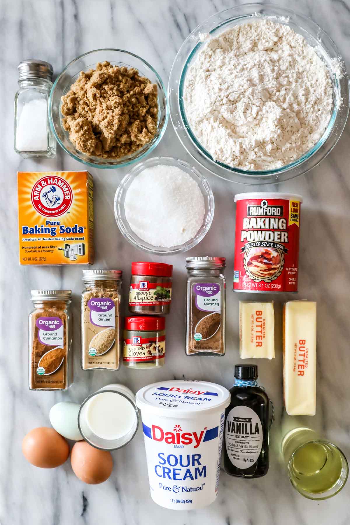 Overhead view of ingredients including spices, flour, sour cream, and more.