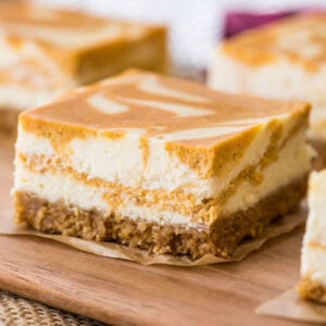 Close-up of a swirled pumpkin cheesecake bar.