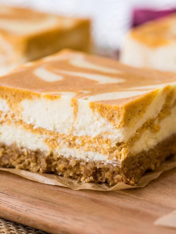 Close-up of a swirled pumpkin cheesecake bar.
