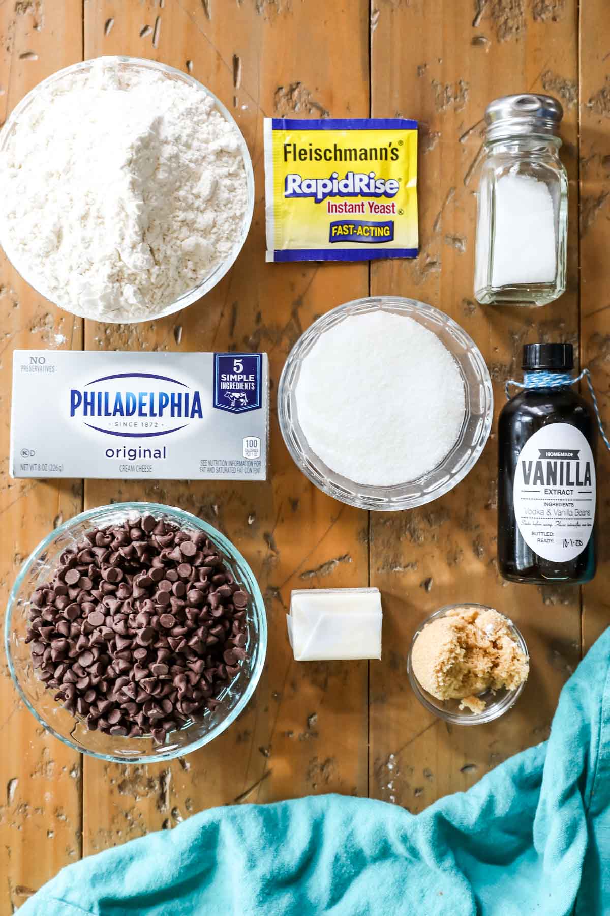 Overhead view of ingredients including flour, rapid rise yeast, cream cheese, chocolate chips, and more.