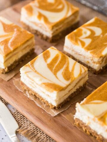 Overhead view of swirled cheesecake bars just after being cut.
