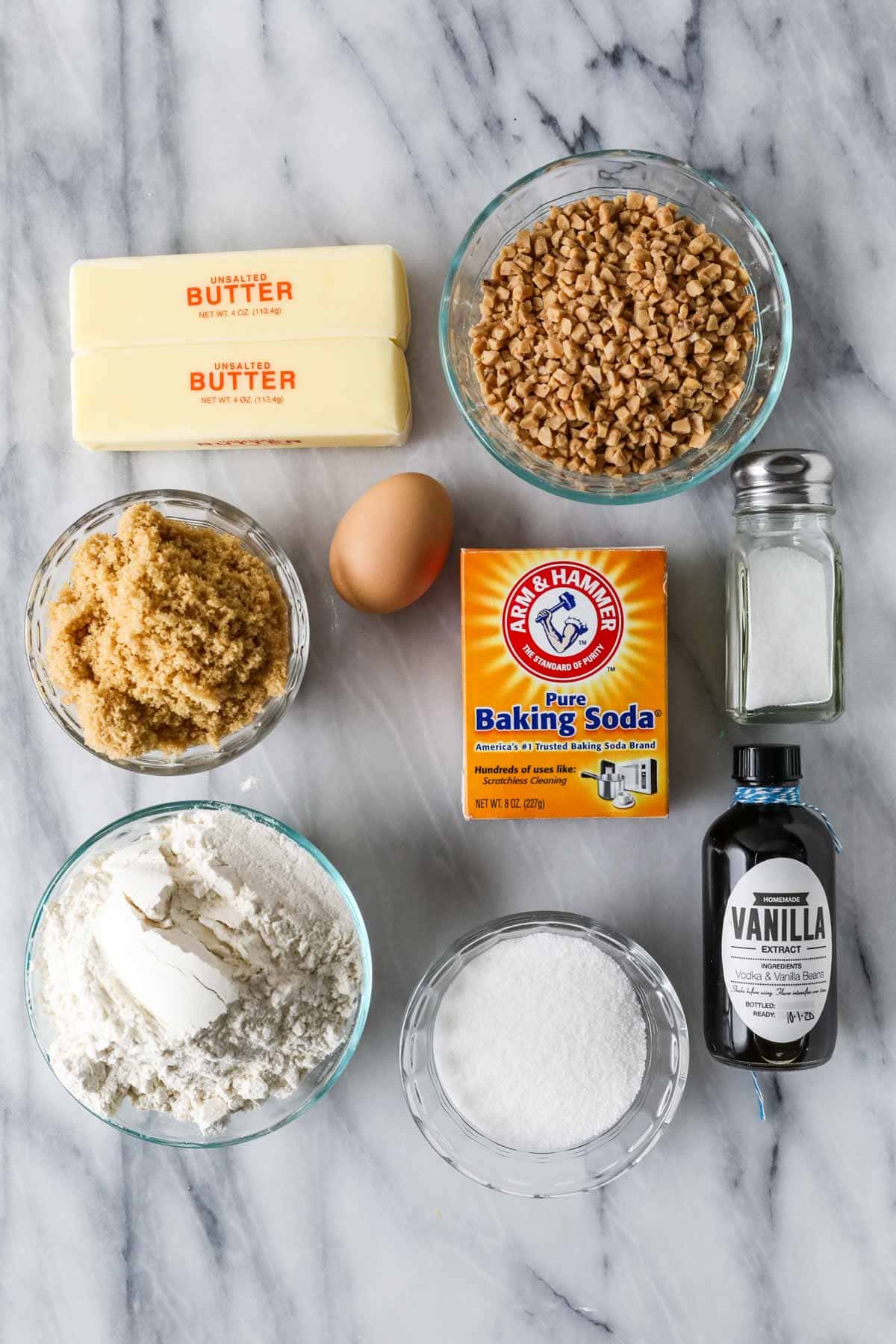 Overhead view of ingredients including toffee bits, butter, brown sugar, baking soda, and more.