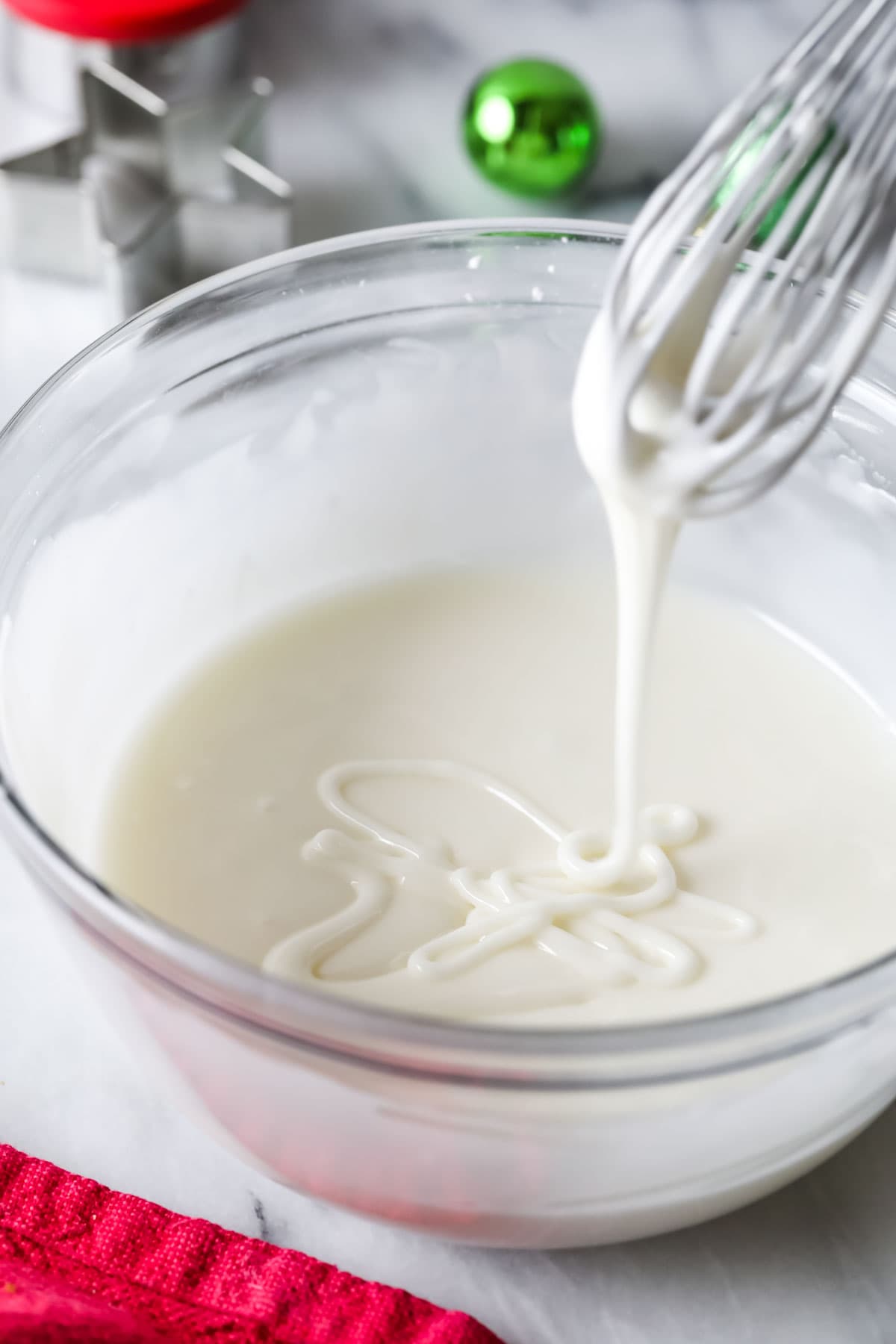 Whisk drizzling icing back into a bowl.